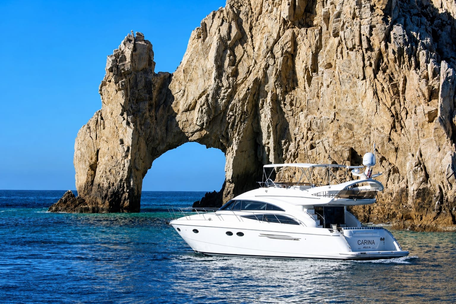 Boat in front of the Arch of Cabo San Lucas, gateway to Baja California Sur