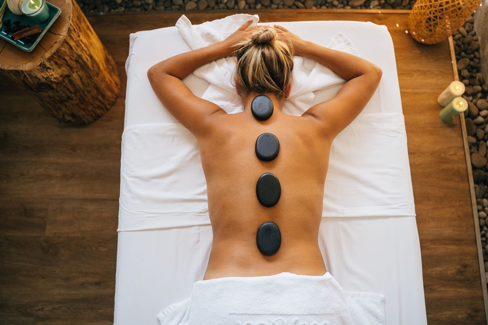 Hot stone massage with candles set up at a villa spa